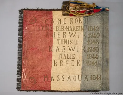 * Le premier Drapeau de la 13ème Demi-Brigade de la Légion Etrangère (DBLE).